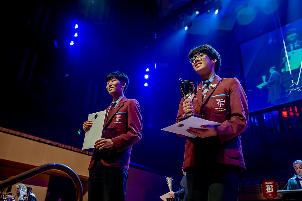 JPC alumnus Adam Li receiving an award on stage at Speech Night