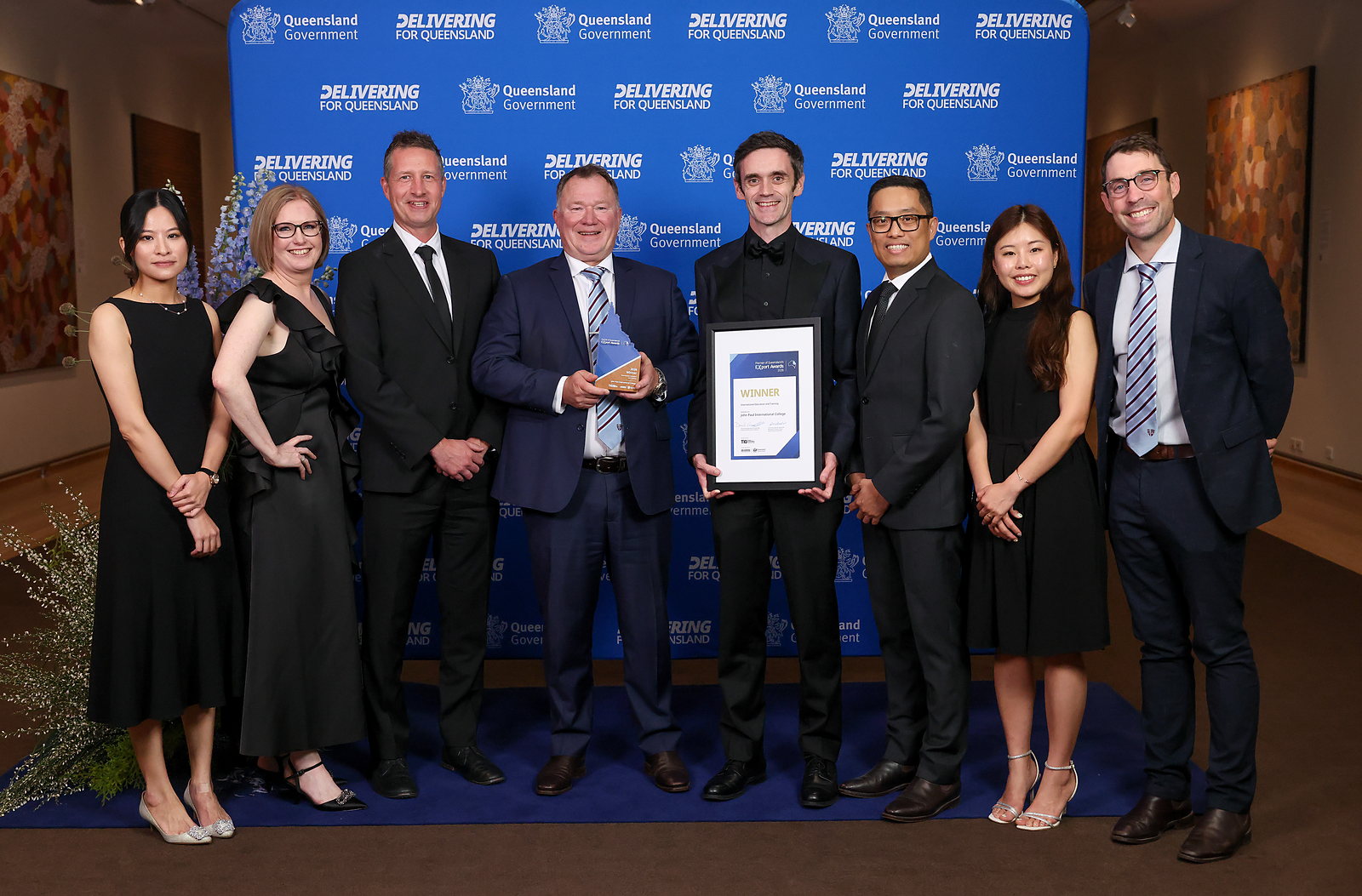 The John Paul College International team with the 2026 Winner trophy and certificate at the Premier of Queensland's Export Awards