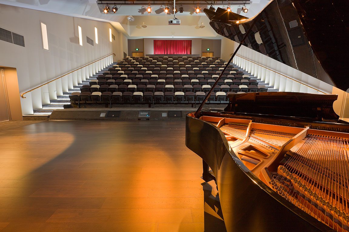 The Stephen Bean Theatre auditorium with a grand piano on stage