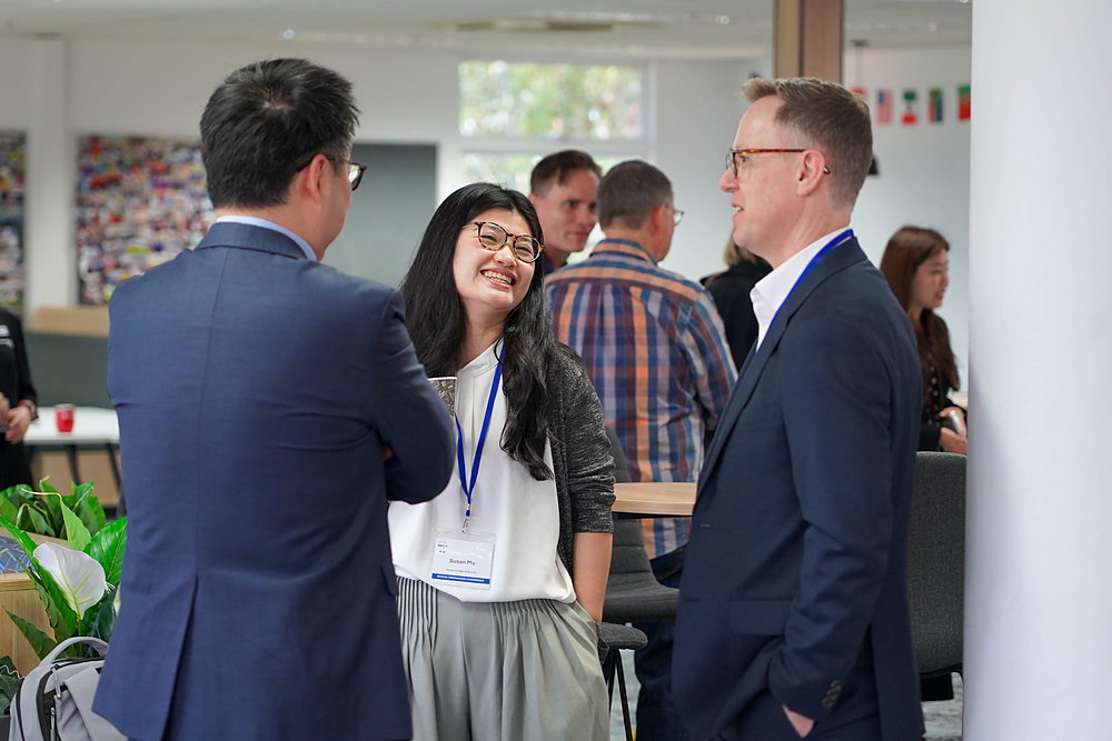 Delegates in conversation during a break