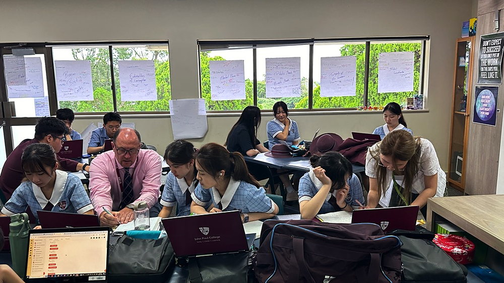 Students in the Extended Day Program at John Paul International College working together after school