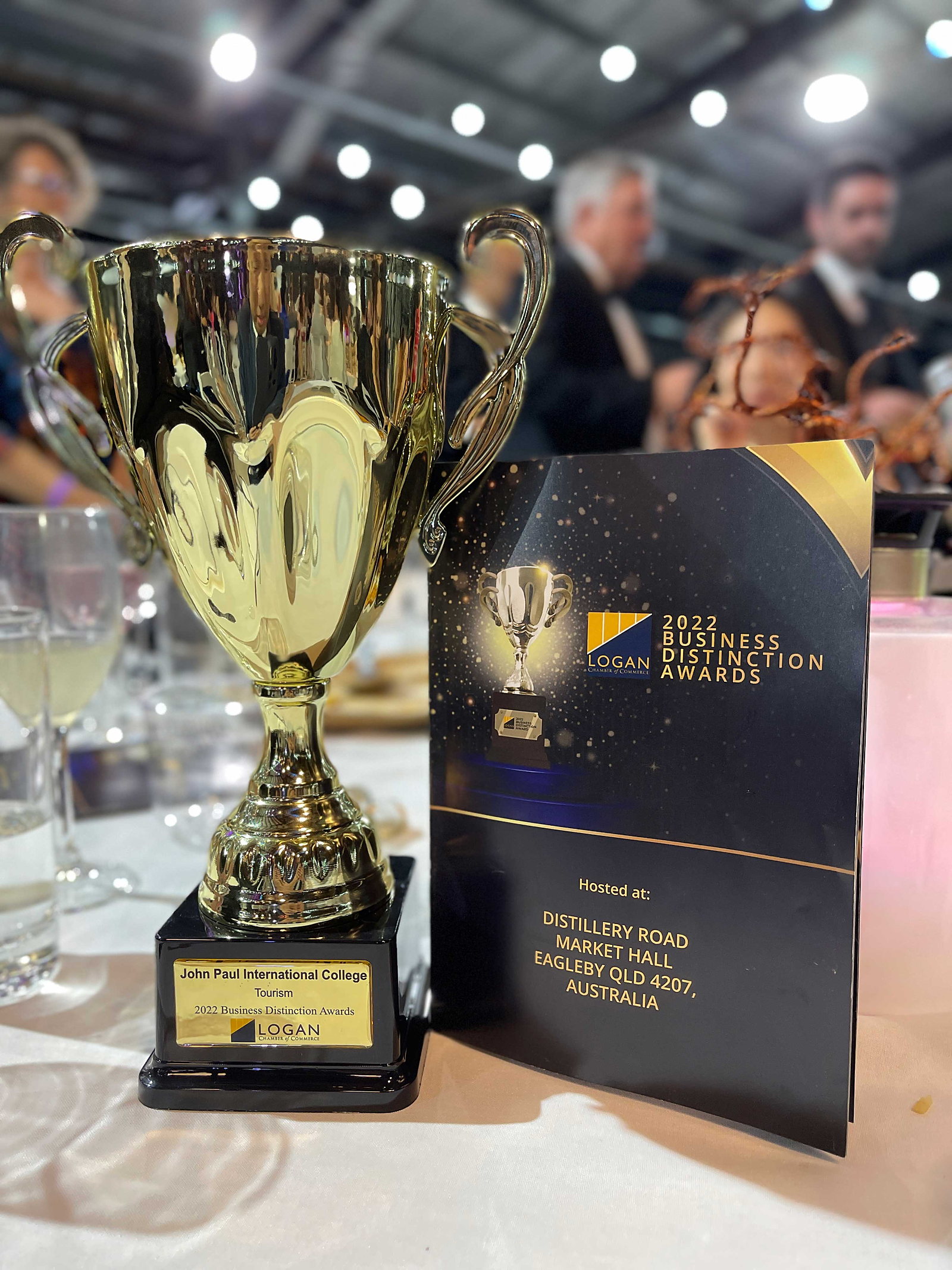 John Paul International College business award trophy on display at an awards ceremony