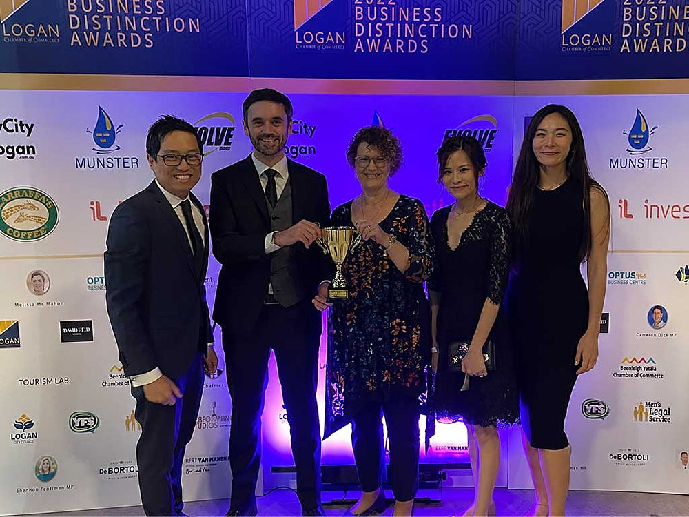 The John Paul International College team receiving a business award