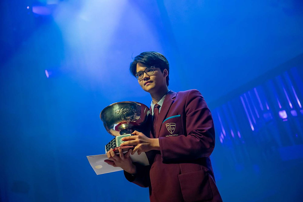Nam Nguyen holding the Dux of the College trophy