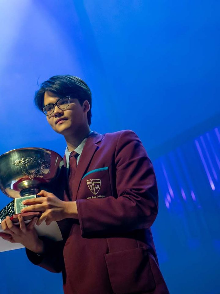 JPC alumnus Nguyen Duc Nam, 2020 Dux of the College, holding the Dux trophy