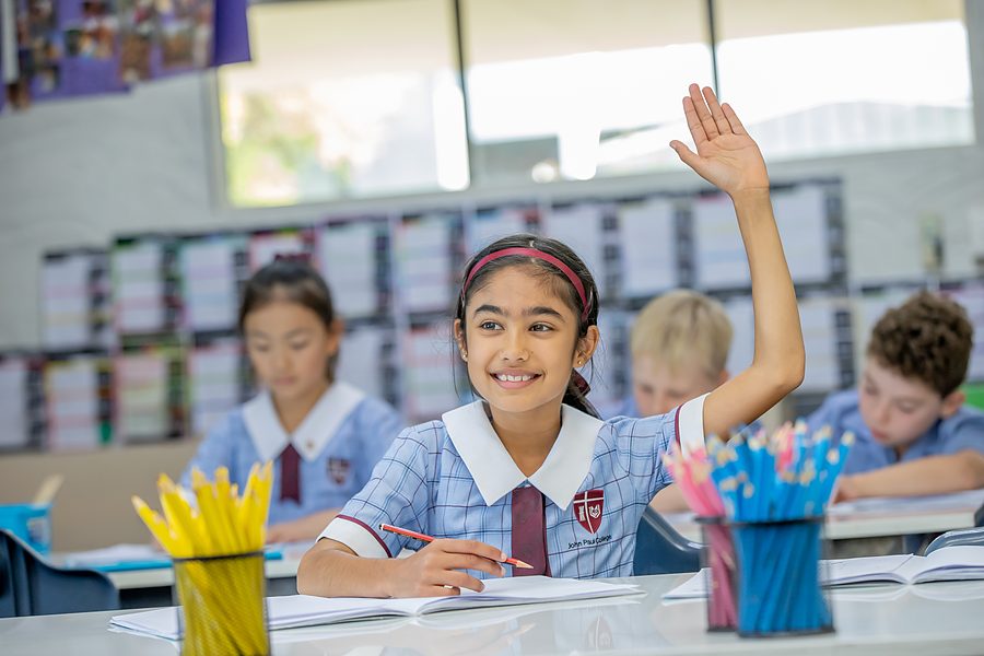 A confident primary student engaged in class