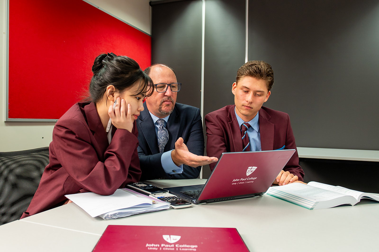International students working alongside Australian classmates in a John Paul College classroom