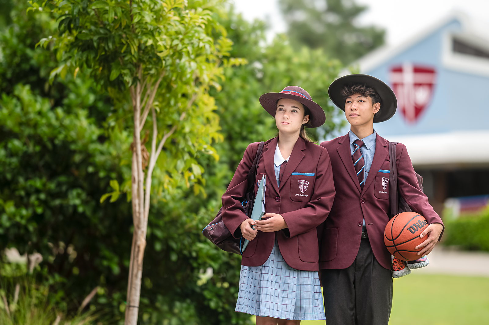 Two John Paul College students walking together on the Daisy Hill campus