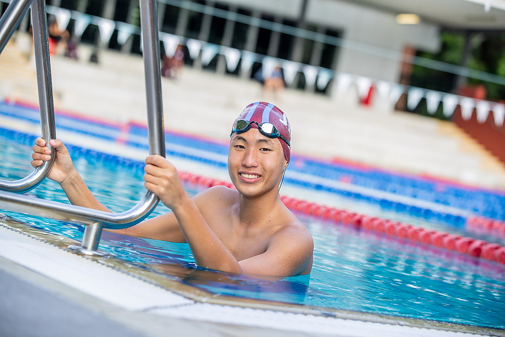 A John Paul College student at early-morning swim squad training